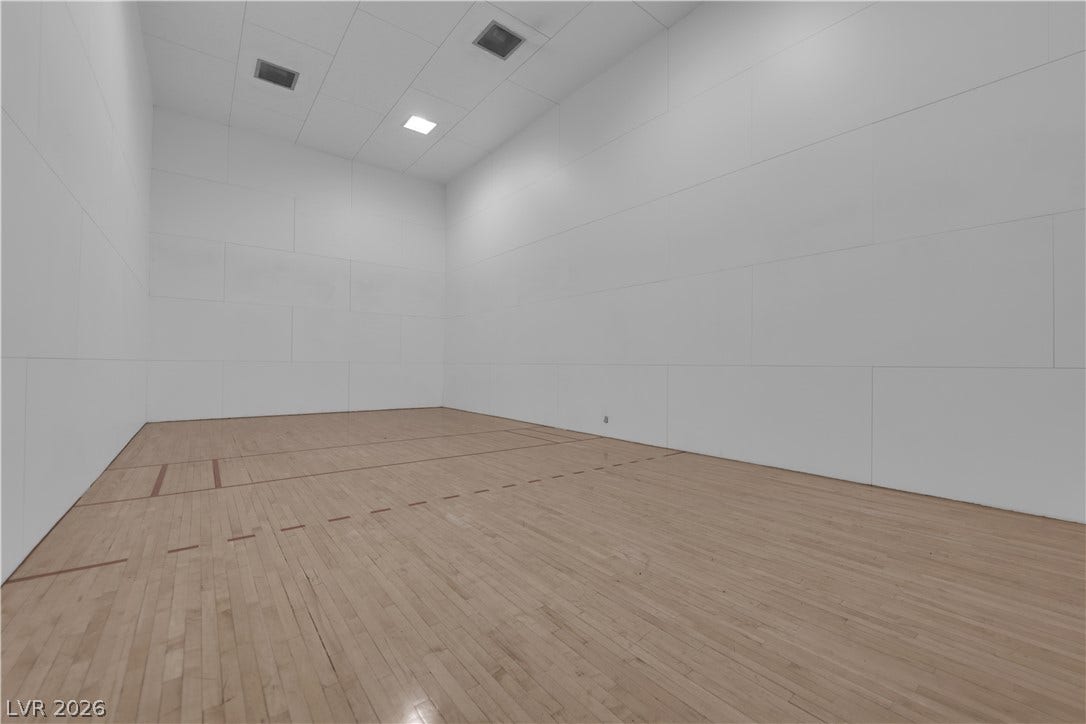 220 E Flamingo Road, #117, Las Vegas, NV 89169 Polished hardwood flooring spans this indoor court designed under high ceilings.