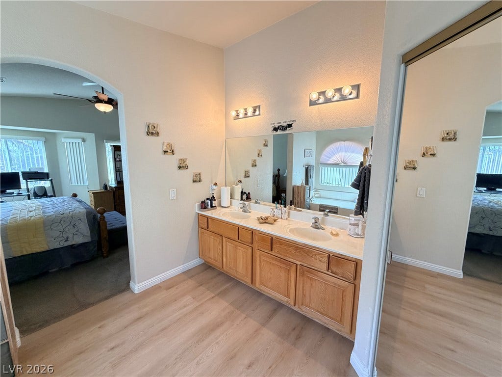 3917 Robin Knot Court, North Las Vegas, NV 89084 A spacious vanity area connects seamlessly to the primary bedroom suite.