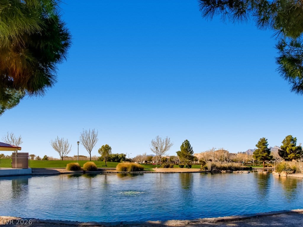 3917 Robin Knot Court, North Las Vegas, NV 89084 Aliante Discovery Park with serene pond views offer a peaceful backdrop framed by mature trees and open green spaces.