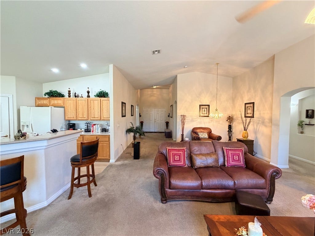 3917 Robin Knot Court, North Las Vegas, NV 89084 An open floorplan seamlessly connects the casual living area to the adjacent kitchen spaces.