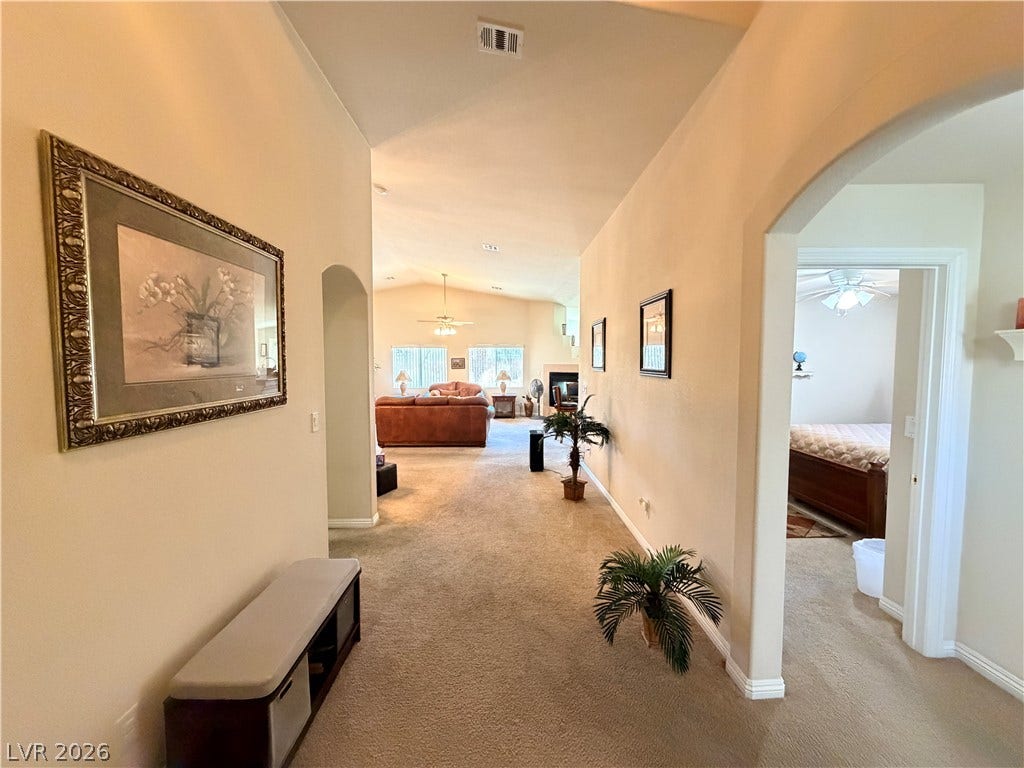 3917 Robin Knot Court, North Las Vegas, NV 89084 An inviting wide entrance features soft carpeting, vaulted ceilings, and graceful arched doorways on the way back to the open layout.