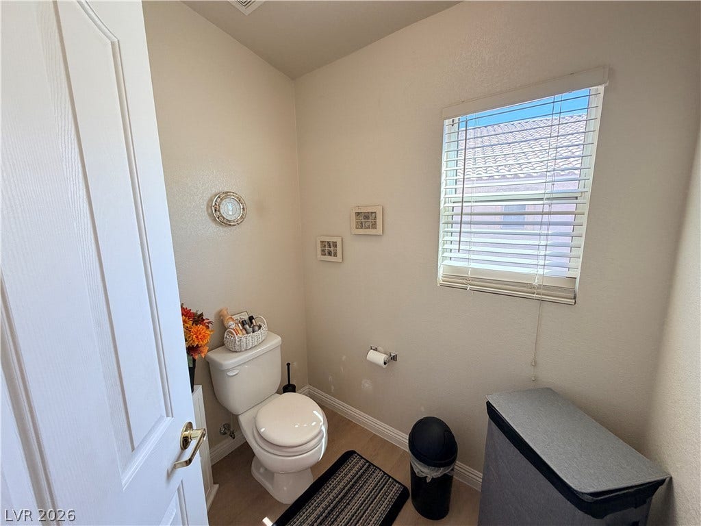 3917 Robin Knot Court, North Las Vegas, NV 89084 Natural light pours through a generous window in the water closet.