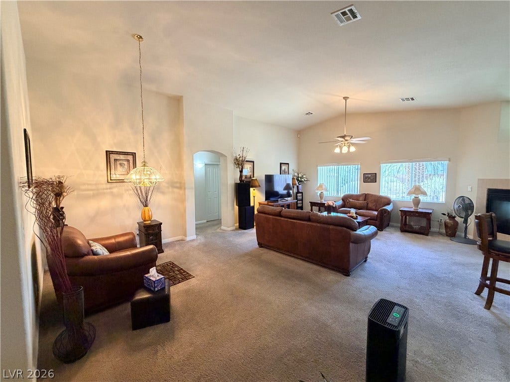 3917 Robin Knot Court, North Las Vegas, NV 89084 An open floor plan connects the carpeted living spaces under vaulted ceilings.
