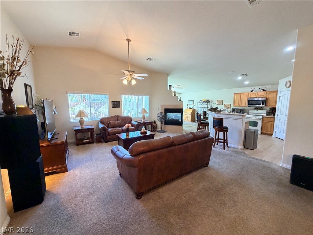 3917 Robin Knot Court, North Las Vegas, NV 89084 An open floor plan flows seamlessly from the carpeted living space into the adjoining kitchen.