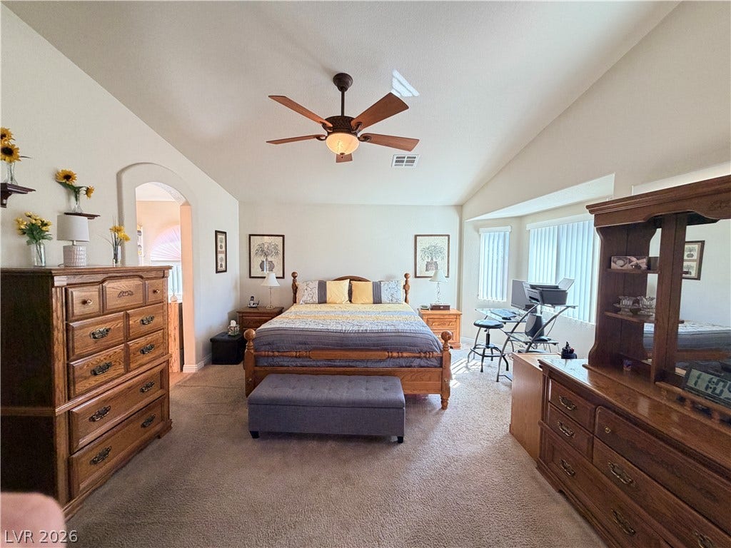 3917 Robin Knot Court, North Las Vegas, NV 89084 Vaulted ceilings and broad windows enhance this comfortable main-level bedroom.