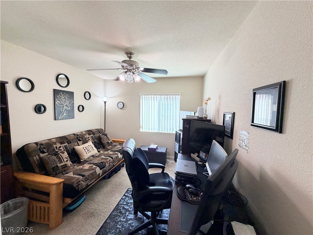 3917 Robin Knot Court, North Las Vegas, NV 89084 Plentiful natural light fills this versatile secondary bedroom workspace featuring durable carpeting.