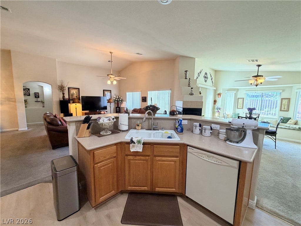3917 Robin Knot Court, North Las Vegas, NV 89084 An open floor plan seamlessly connects the central kitchen to multiple living areas.