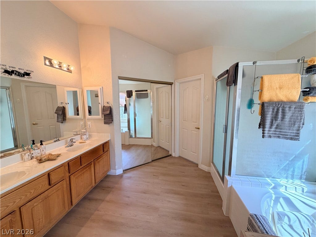 3917 Robin Knot Court, North Las Vegas, NV 89084 Ample natural light illuminates this spacious bathroom complete with a long double vanity.
