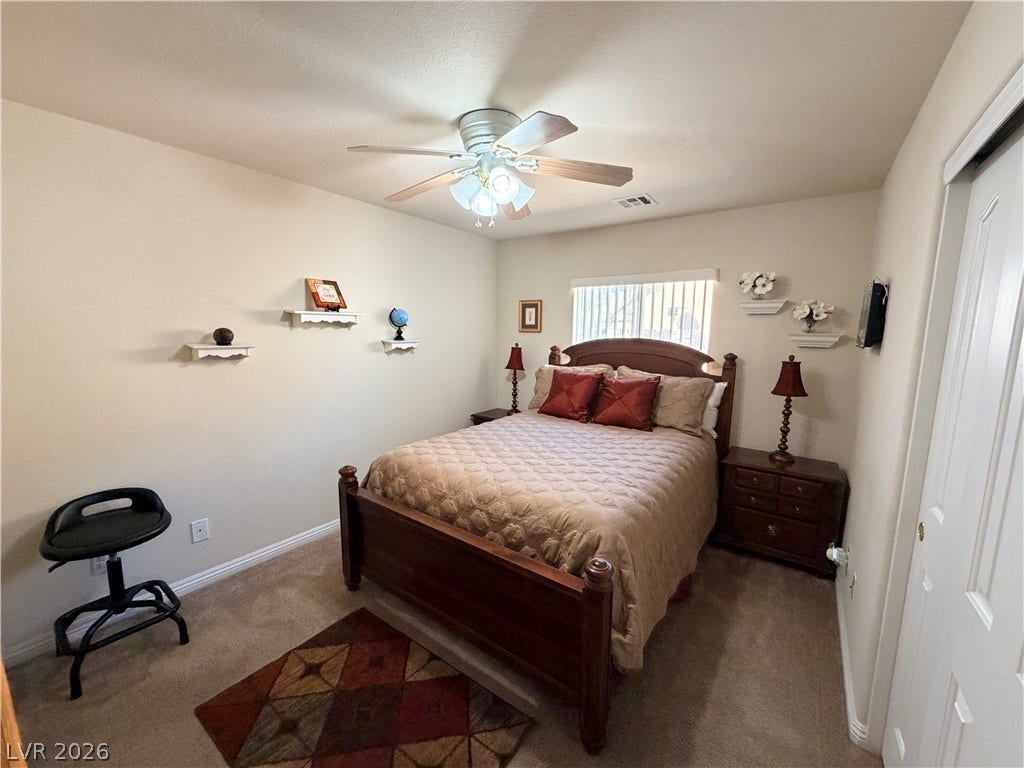 3917 Robin Knot Court, North Las Vegas, NV 89084 Soft carpeting pairs with neutral walls to create a restful, welcoming bedroom environment.