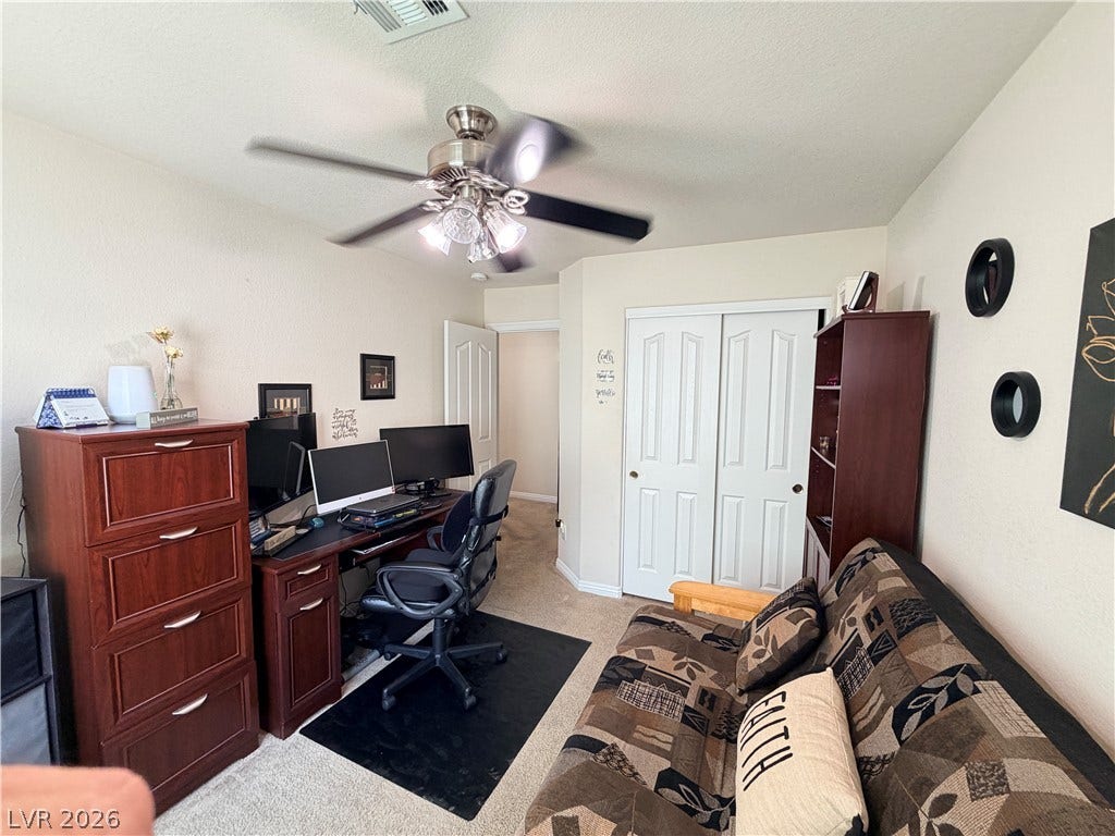 3917 Robin Knot Court, North Las Vegas, NV 89084 Plush carpeting anchors this versatile room, illuminated by overhead lighting and featuring built-in closet storage.
