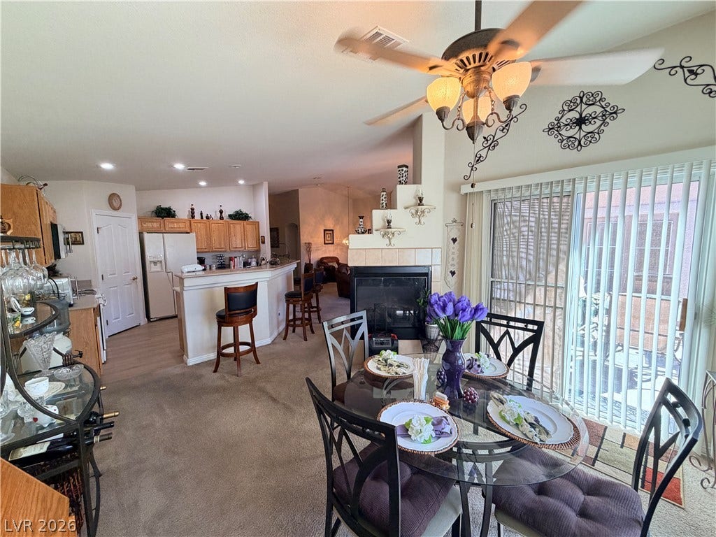 3917 Robin Knot Court, North Las Vegas, NV 89084 An open floor plan connects the kitchen and dining area under tall ceilings.