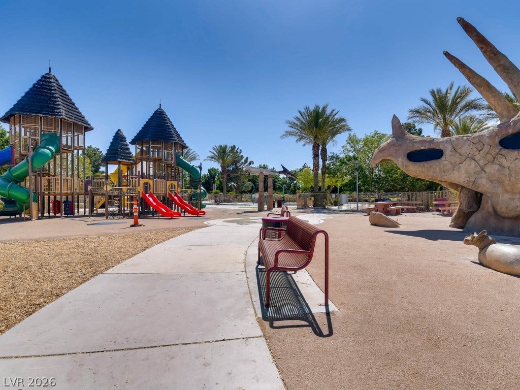 3917 Robin Knot Court, North Las Vegas, NV 89084 Aliante Discovery Park, pathways wind through a beautifully designed recreational park beneath clear blue skies.