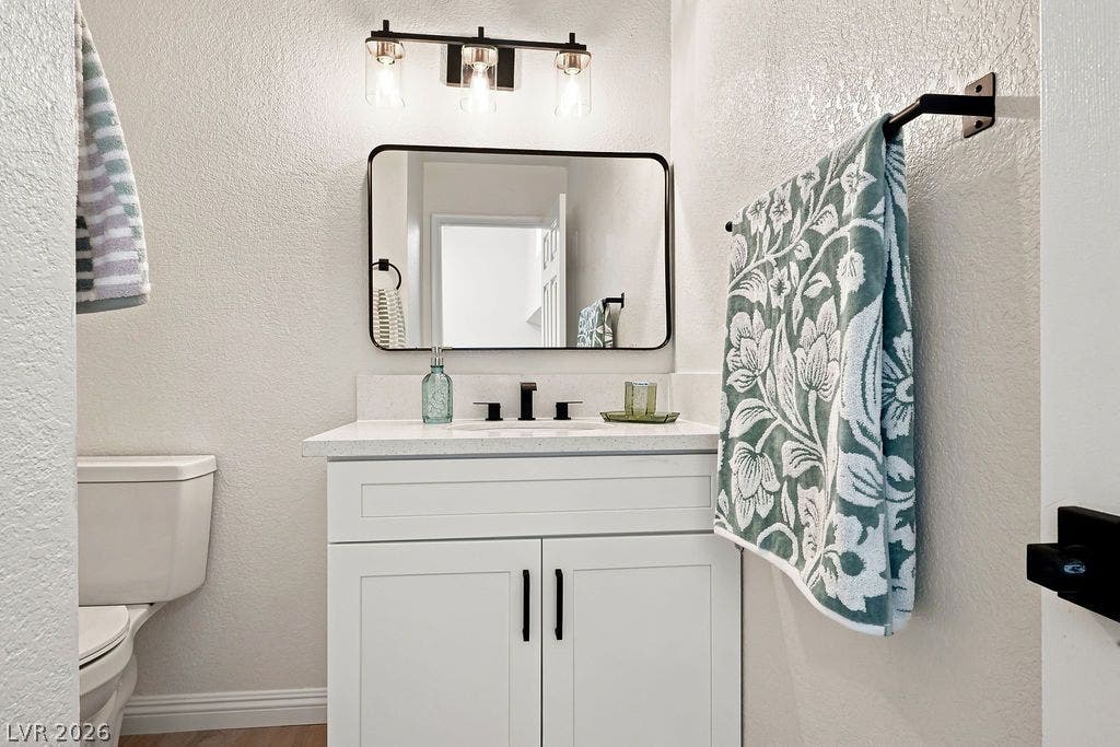 6250 W Flamingo Road, #62, Las Vegas, NV 89103 Stylishly updated bathroom featuring a modern white vanity and sleek black accents.