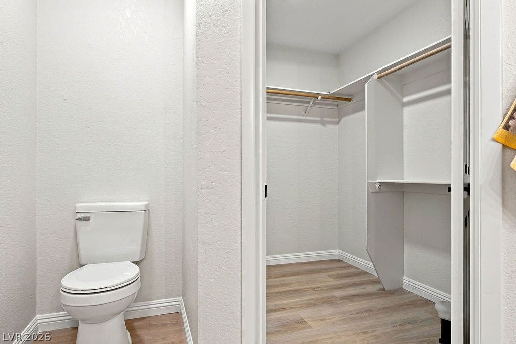 6250 W Flamingo Road, #62, Las Vegas, NV 89103 Spacious walk-in closet complete with built-in shelving and wooden hanging racks.