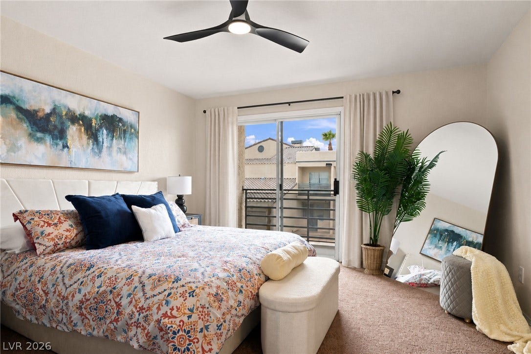 6250 W Flamingo Road, #62, Las Vegas, NV 89103 Bright and spacious primary bedroom featuring a modern ceiling fan and private balcony.