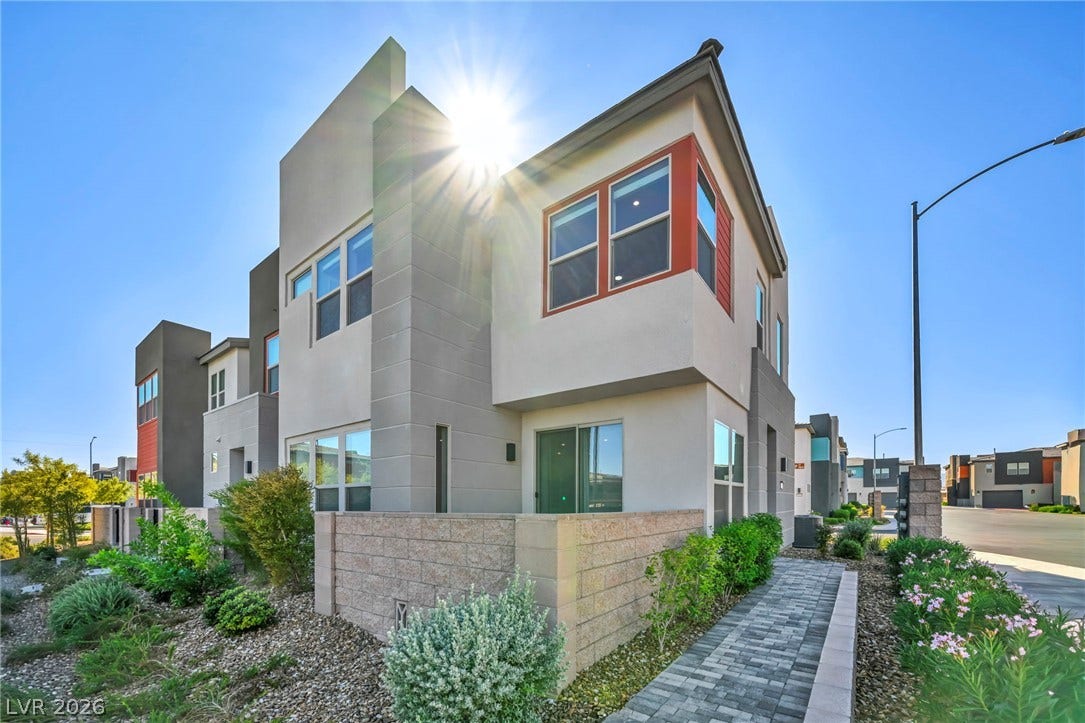 9826 Canyon Sage Street, Las Vegas, NV 89141 Striking contemporary architecture defines this multi-level exterior framed by low-maintenance desert landscaping.