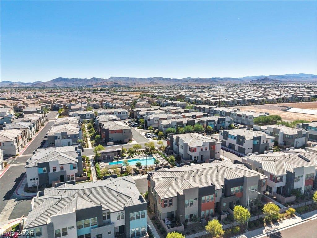 9826 Canyon Sage Street, Las Vegas, NV 89141 Distant mountains frame a sprawling modern community complete with an inviting neighborhood pool.