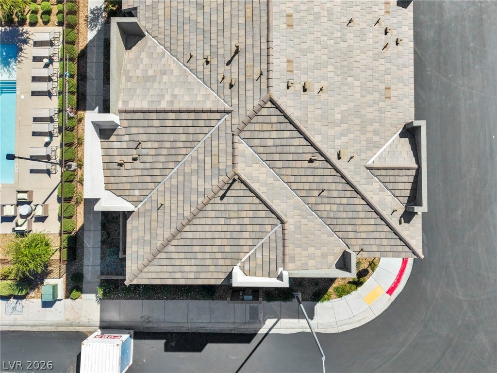 9826 Canyon Sage Street, Las Vegas, NV 89141 An aerial perspective reveals the detailed architectural structure and adjacent pool amenities of this property.