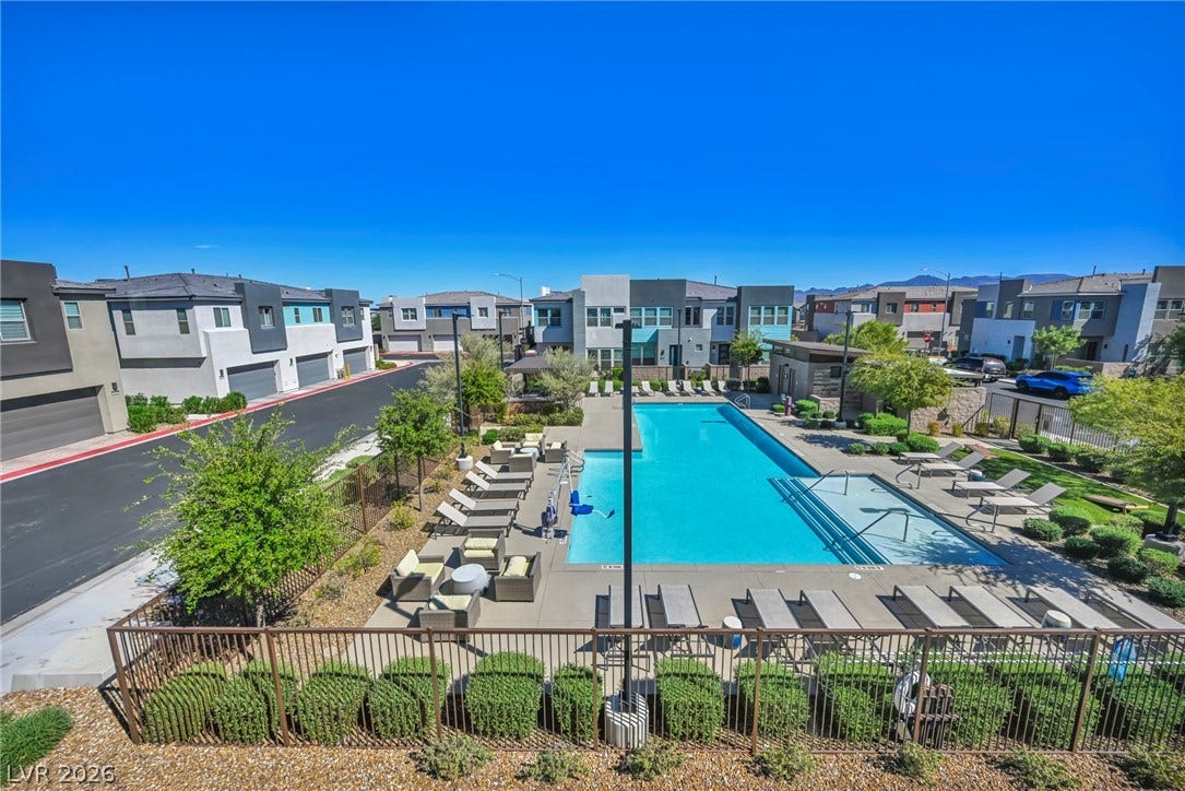 9826 Canyon Sage Street, Las Vegas, NV 89141 A sparkling community pool offers private recreation steps from modern neighborhood residences.