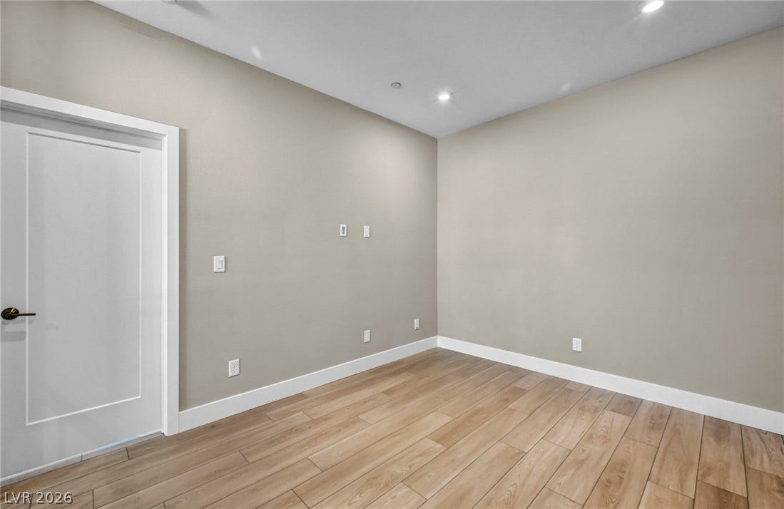 9826 Canyon Sage Street, Las Vegas, NV 89141 Smooth wood-look flooring and crisp trim define this versatile, recessed-lit interior room.