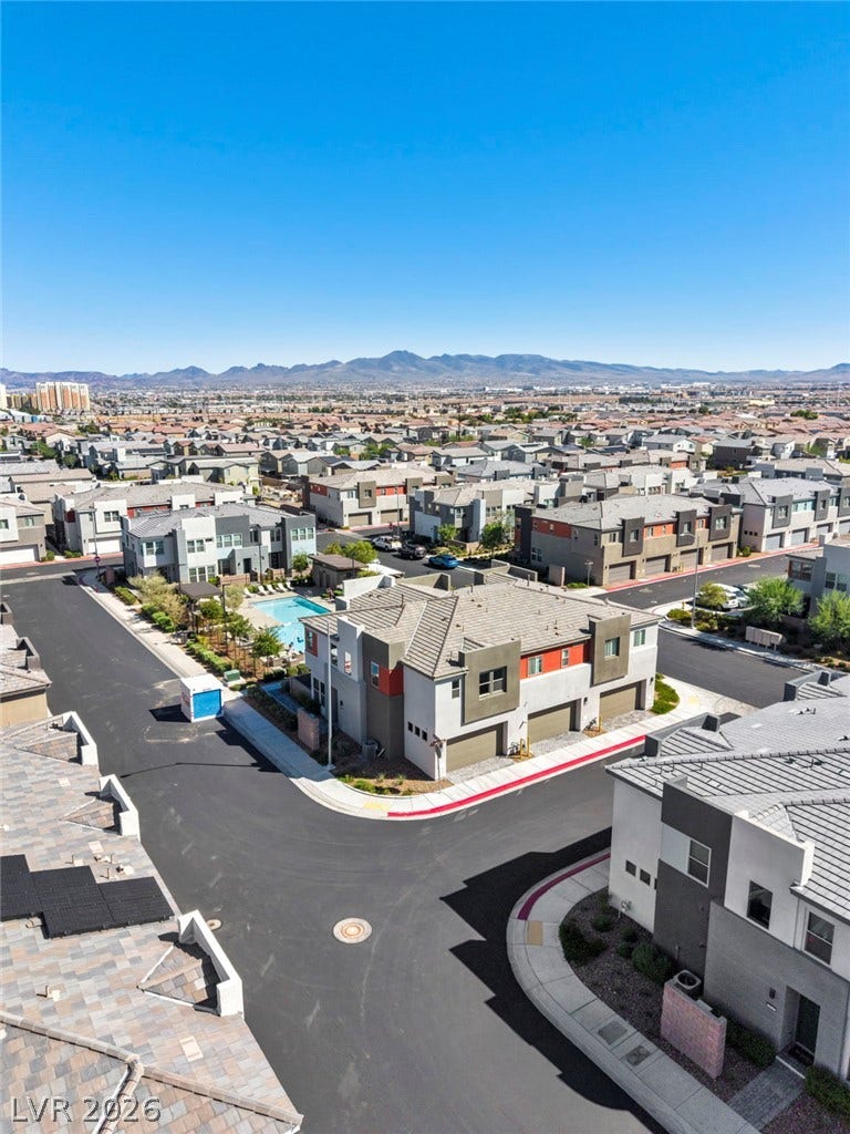 9826 Canyon Sage Street, Las Vegas, NV 89141 Distant mountain ridges frame this modern master-planned community under clear desert skies.