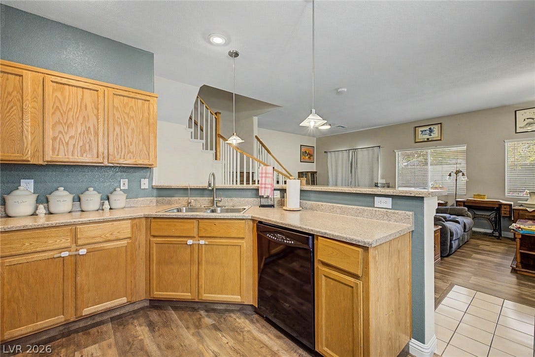 6041 Turning Spoke Trail, #102, Henderson, NV 89011 An open kitchen design connects seamlessly to adjacent living areas on the main level.