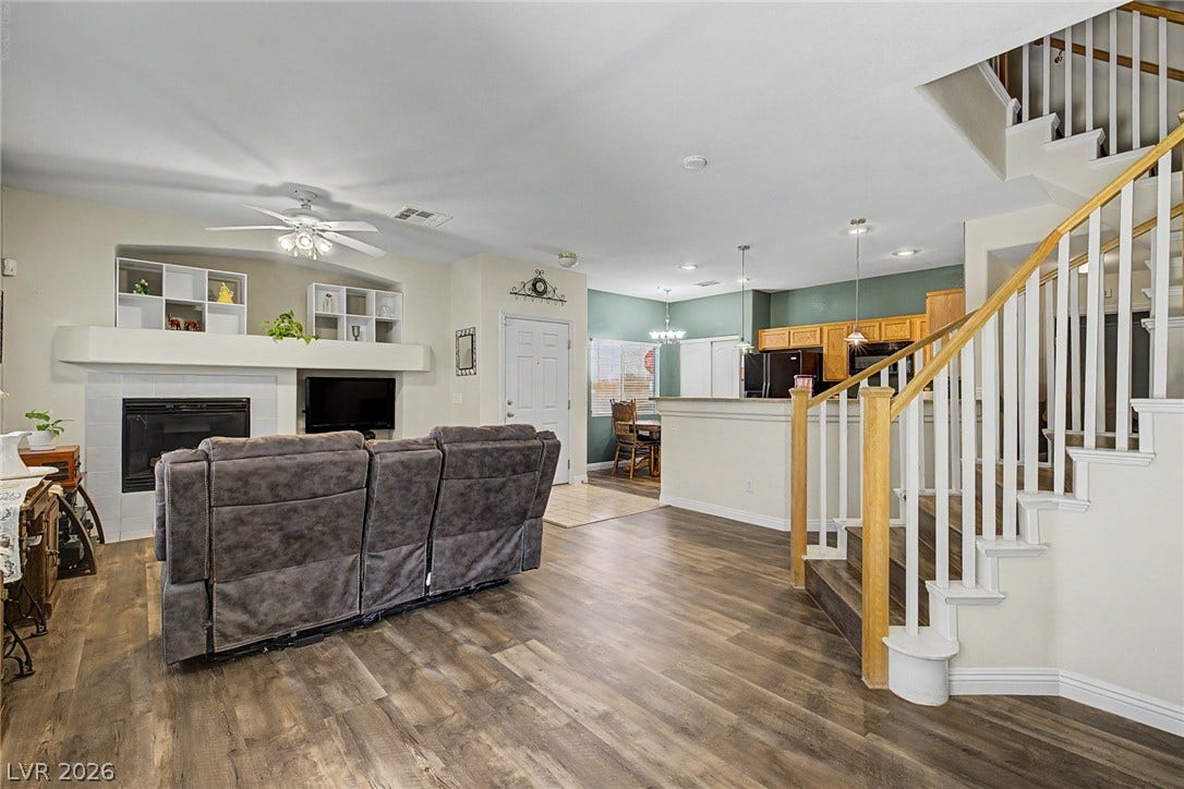 6041 Turning Spoke Trail, #102, Henderson, NV 89011 An open floorplan seamlessly connects the living space to the adjacent kitchen and dining areas.