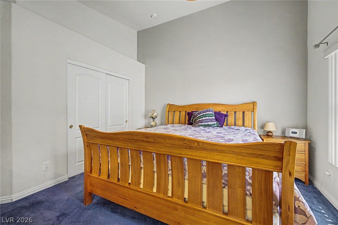 6041 Turning Spoke Trail, #102, Henderson, NV 89011 High vaulted ceilings bring architectural depth to this bedroom space.