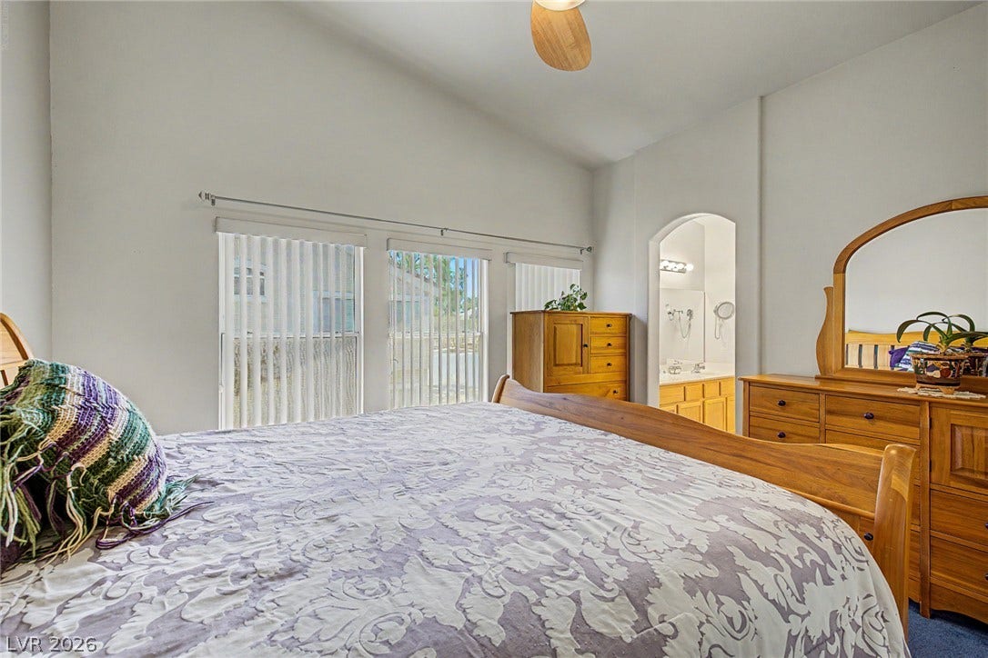 6041 Turning Spoke Trail, #102, Henderson, NV 89011 High vaulted ceilings and ample window light define this comfortable main bedroom space.