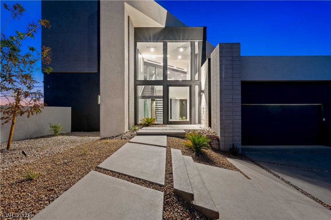 25 Boulderback Drive, Henderson, NV 89012 Striking contemporary architecture defines this dramatic entryway with soaring glass panels.