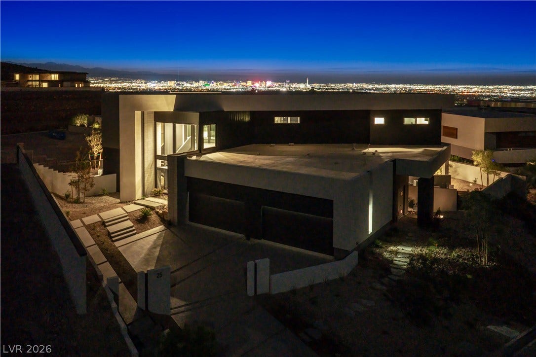 25 Boulderback Drive, Henderson, NV 89012 Glimmering city skyline vistas provide a dramatic backdrop for this modern architectural estate.