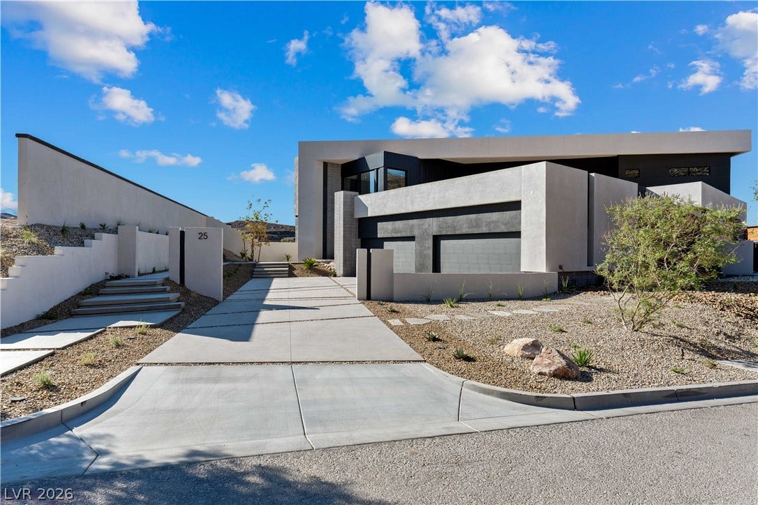 25 Boulderback Drive, Henderson, NV 89012 Bold contemporary architecture defines this striking desert residence with clean lines and geometric concrete forms.