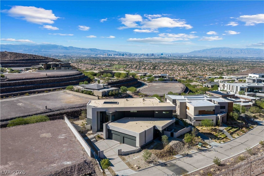 25 Boulderback Drive, Henderson, NV 89012 Striking contemporary architecture crowns this elevated hillside property showcasing panoramic valley views.