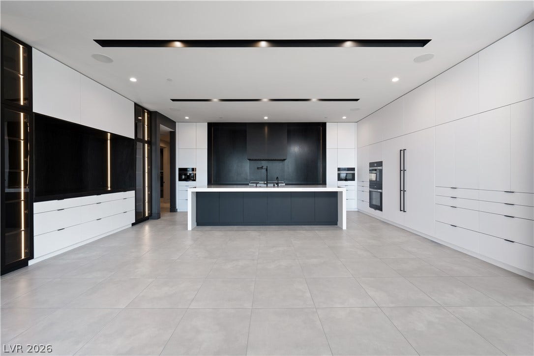 25 Boulderback Drive, Henderson, NV 89012 Minimalist design defines this contemporary kitchen featuring sleek custom cabinetry and large-format tile flooring.