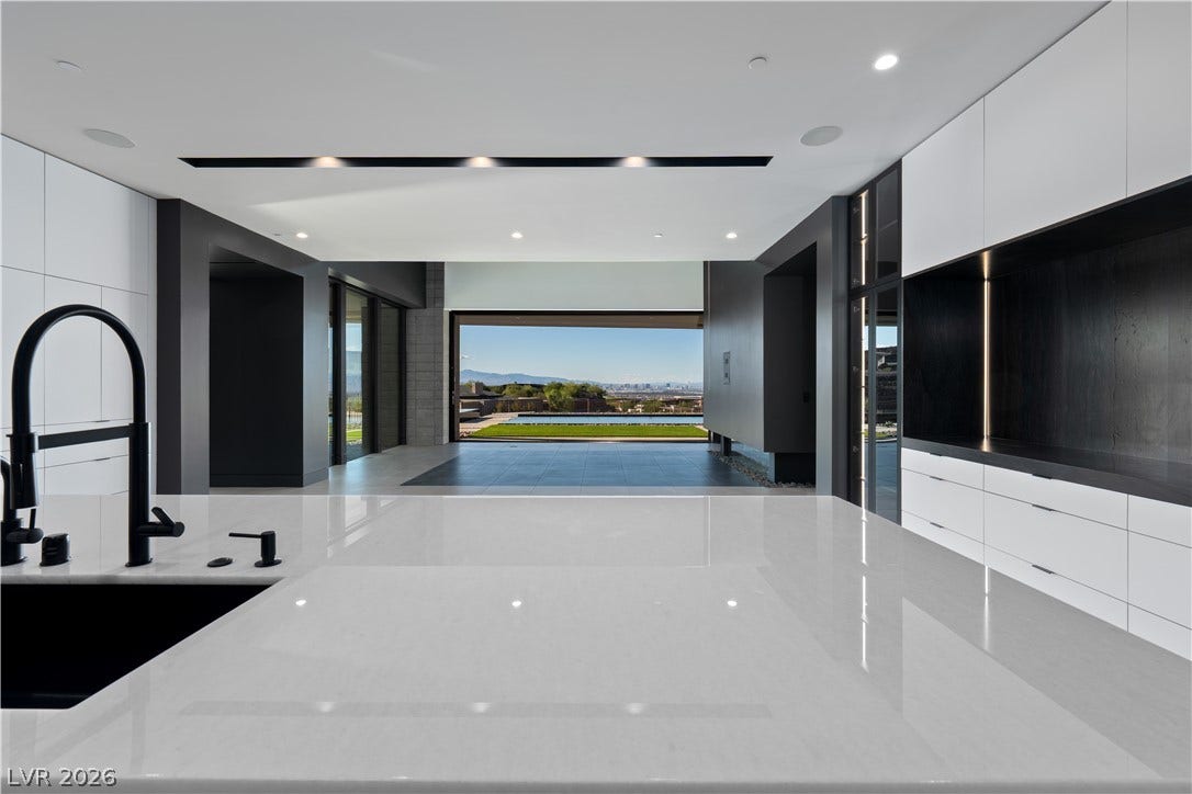 25 Boulderback Drive, Henderson, NV 89012 Gleaming stone countertops frame an open-concept design looking out toward sweeping valley views.