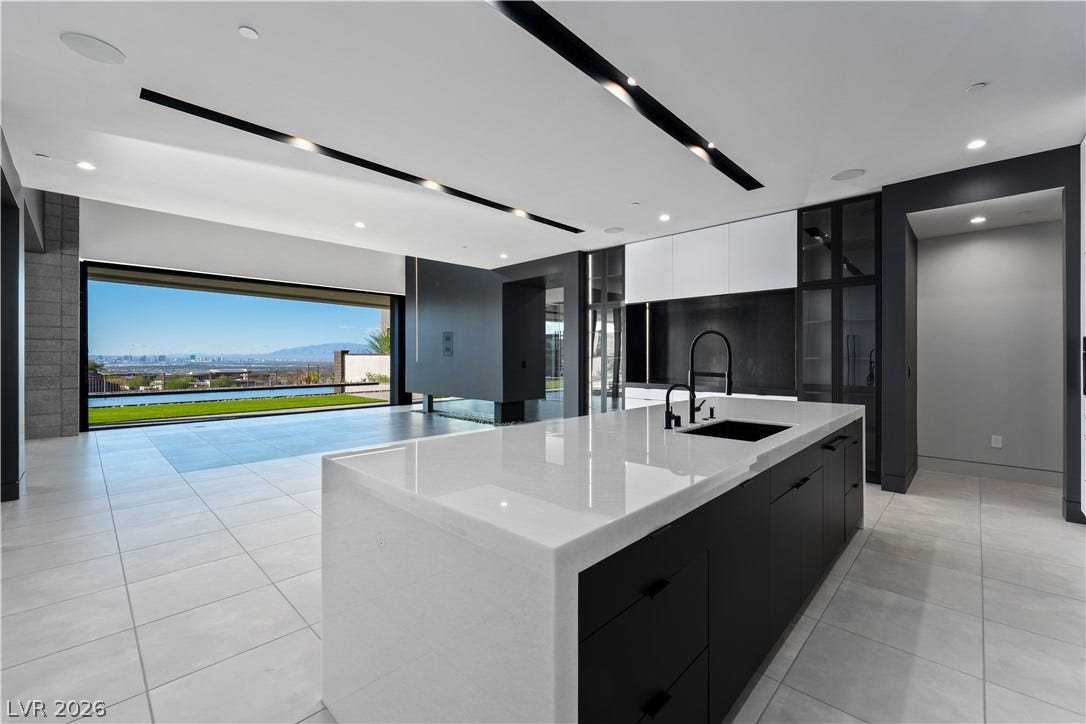 25 Boulderback Drive, Henderson, NV 89012 Sleek contemporary surfaces seamlessly integrate with an open layout framing sweeping desert vistas.