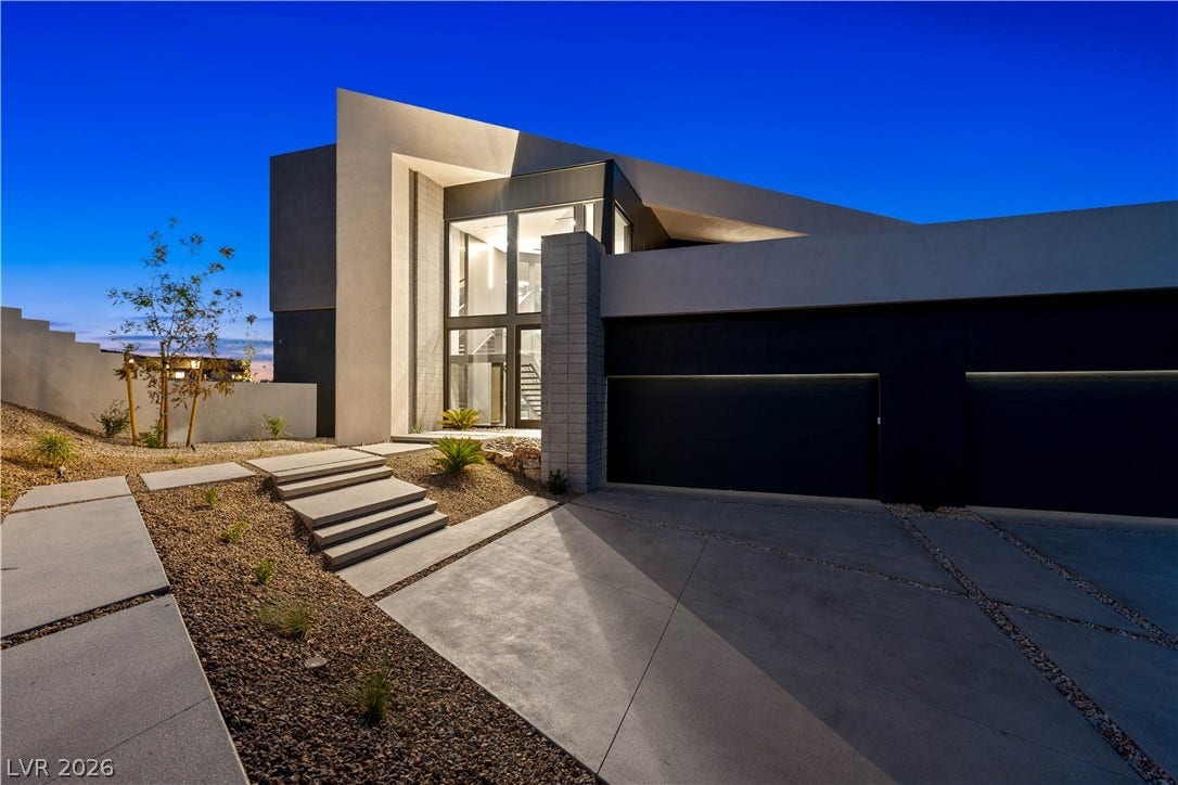 25 Boulderback Drive, Henderson, NV 89012 Striking contemporary architecture defines this dramatic entryway flanked by a sleek multi-car garage.
