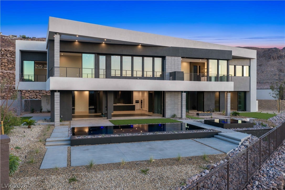 25 Boulderback Drive, Henderson, NV 89012 Sleek architectural lines define this modern multi-level estate featuring an integrated reflecting pool.