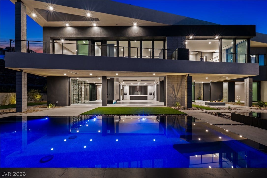 25 Boulderback Drive, Henderson, NV 89012 Dramatic modern architecture integrates seamless indoor-outdoor design overlooking a pristine reflection pool.
