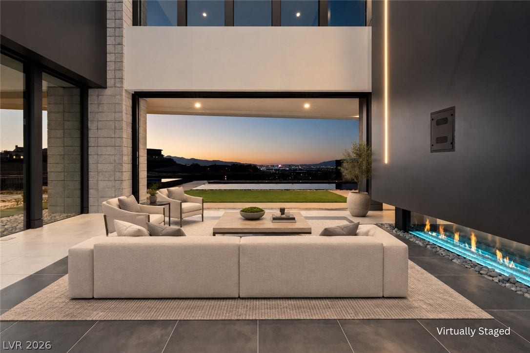25 Boulderback Drive, Henderson, NV 89012 An open-concept living area seamlessly transitions to the outdoors through sliding glass doors.