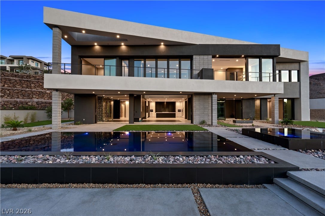 25 Boulderback Drive, Henderson, NV 89012 Dramatic architectural lines frame this modern estate featuring a custom pool and seamless indoor-outdoor living.