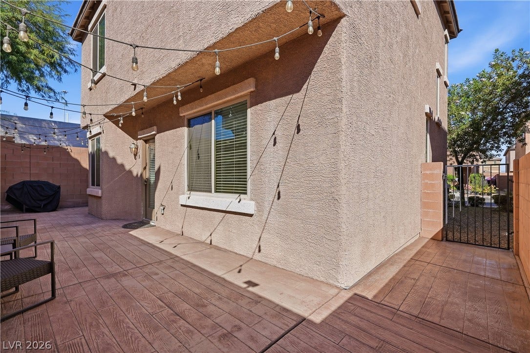 An inviting stamped concrete patio anchors this private outdoor retreat.