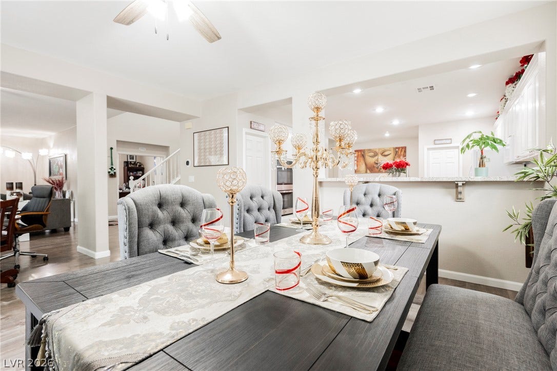 Gleaming hardwood floors and a spacious open layout flow effortlessly into the adjacent kitchen.