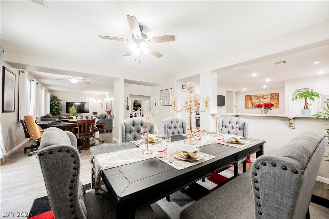 An open dining area flows seamlessly into the main living spaces and kitchen.