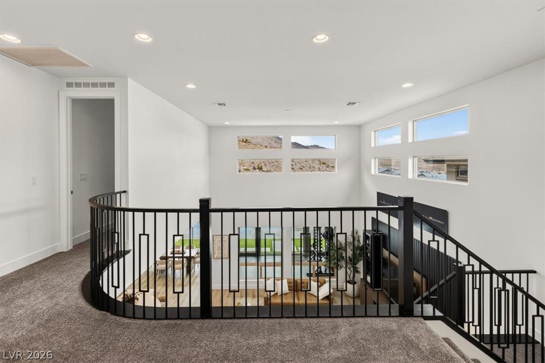 2611 Nevada Agave Lane, Las Vegas, NV 89138 Gleaming recessed lights and high ceilings crown this carpeted upper-level overlook and staircase.