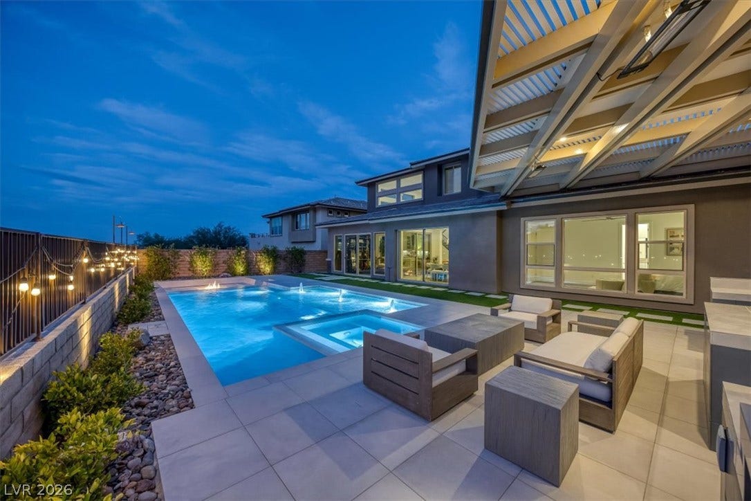 2611 Nevada Agave Lane, Las Vegas, NV 89138 A pristine swimming pool and integrated spa anchor this backyard oasis under a covered patio.