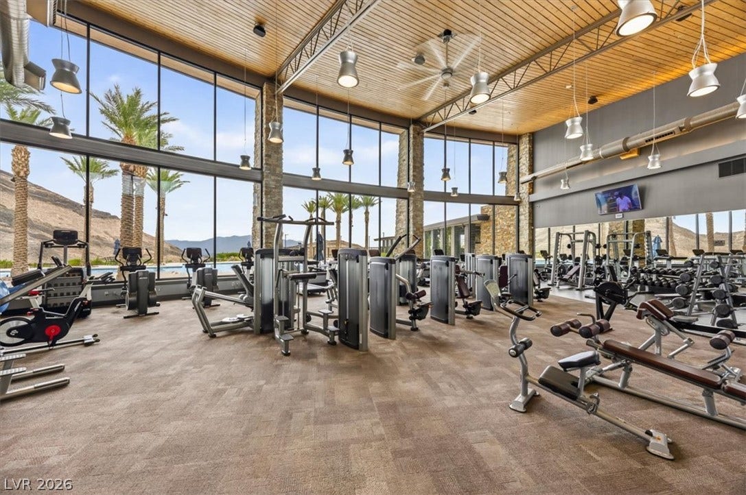 2611 Nevada Agave Lane, Las Vegas, NV 89138 Massive walls of glass frame palm-lined mountain views in this modern fitness facility.