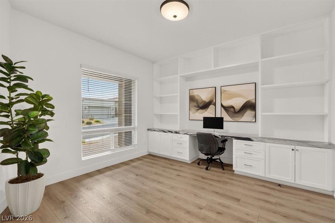 2611 Nevada Agave Lane, Las Vegas, NV 89138 An integrated desk and built-in shelving maximize organization in this versatile home workspace.