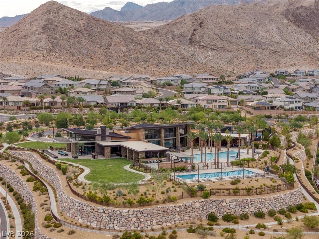 2611 Nevada Agave Lane, Las Vegas, NV 89138 A luxury community clubhouse stands nestled against a dramatic mountain backdrop.