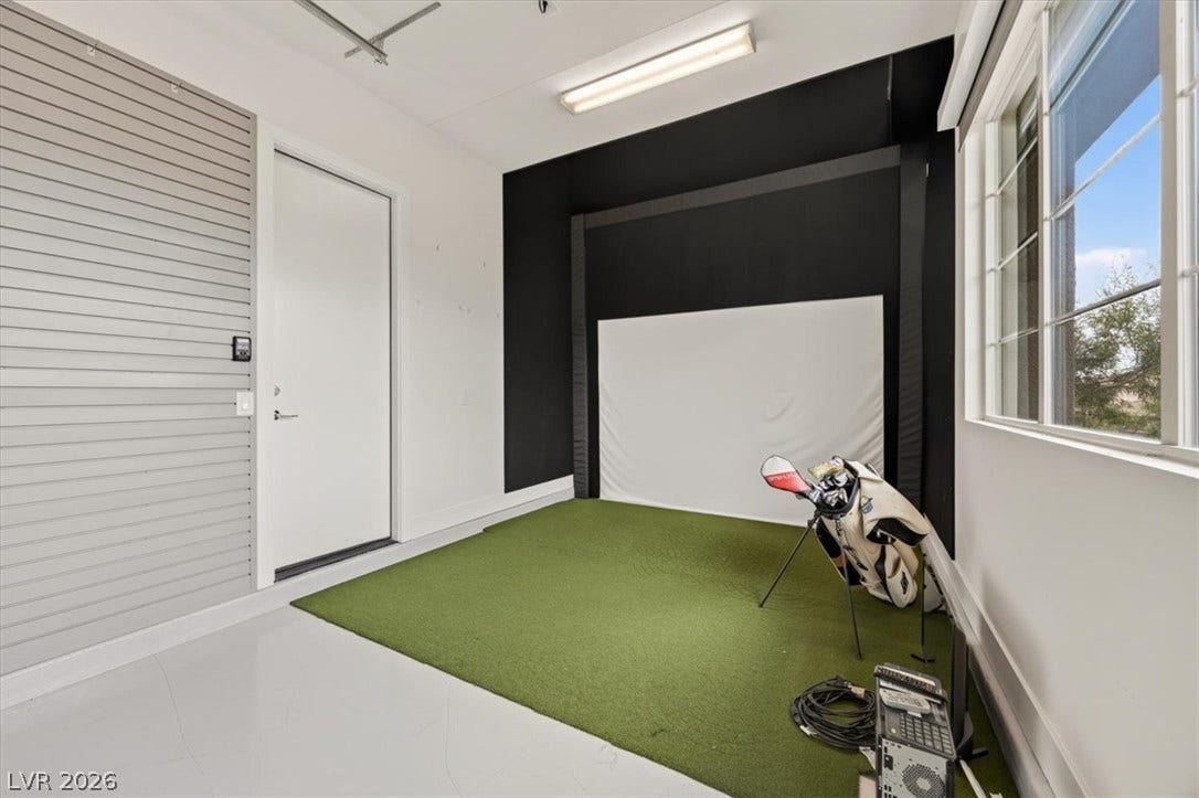 2611 Nevada Agave Lane, Las Vegas, NV 89138 Multi-use recreation space featuring durable concrete flooring, wall slats, and ample natural window light.